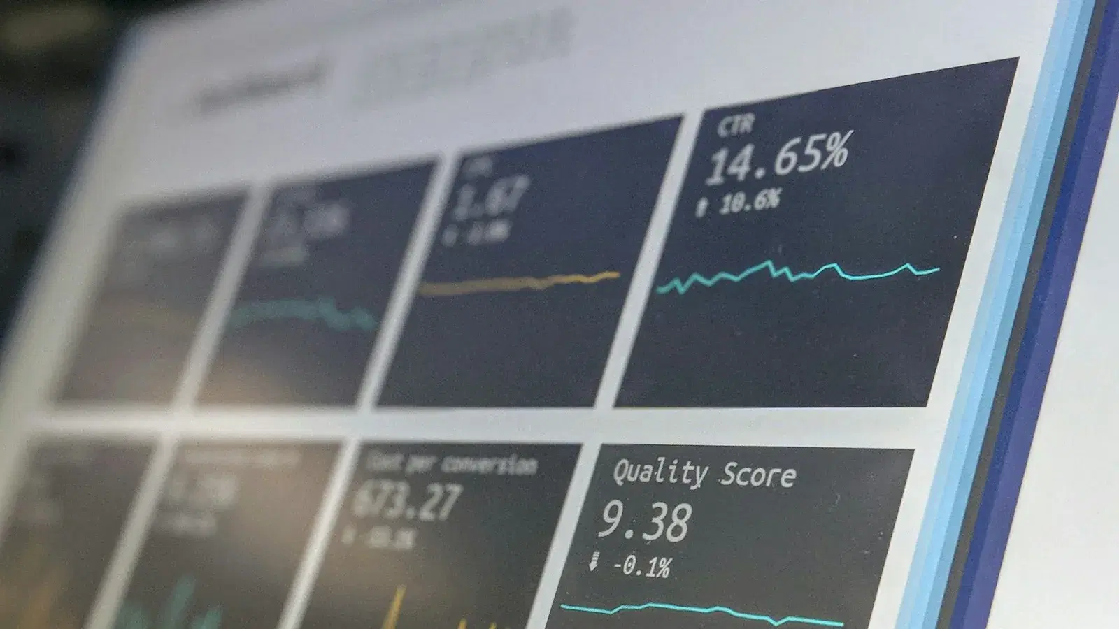 A data reporting dashboard of charts displayed on a laptop screen.