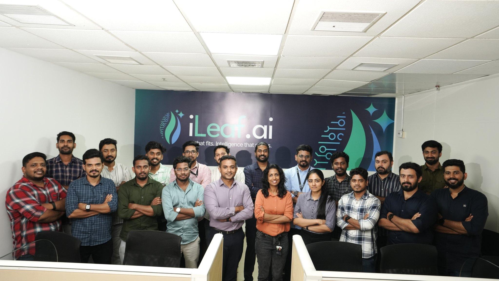 The iLeaf team in front of the iLeaf.ai wall in the Kochi office