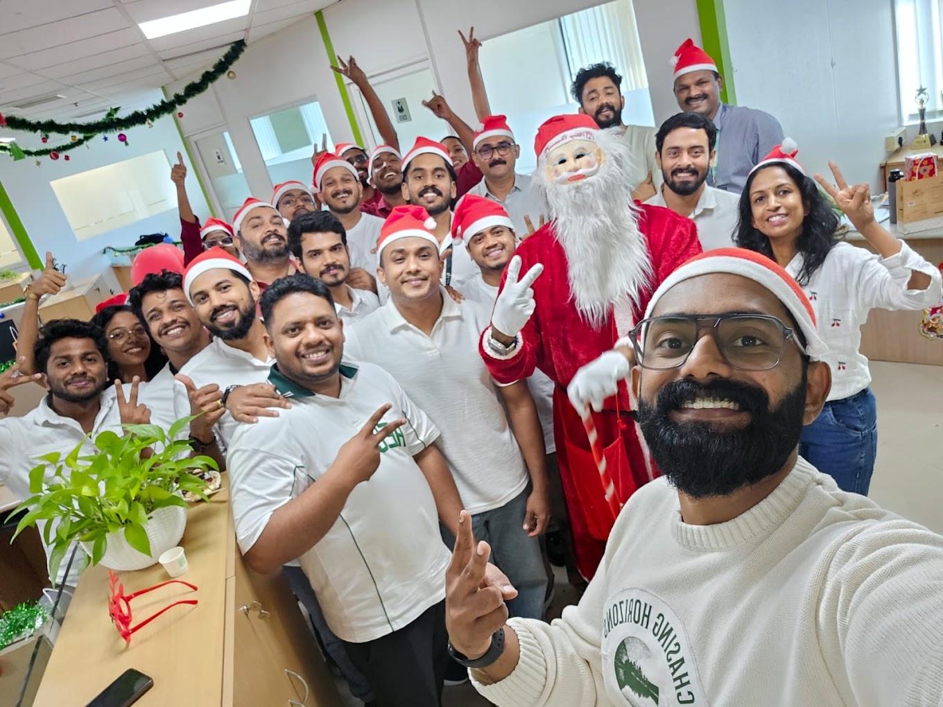 The iLeaf office decorated for Christmas, with the team gathered